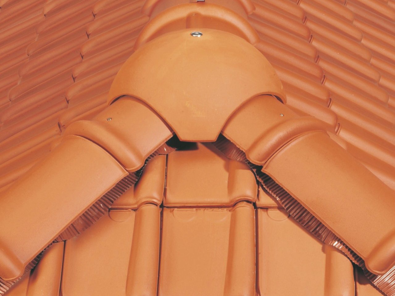 Installing a ridge tile on the roof in a correct way