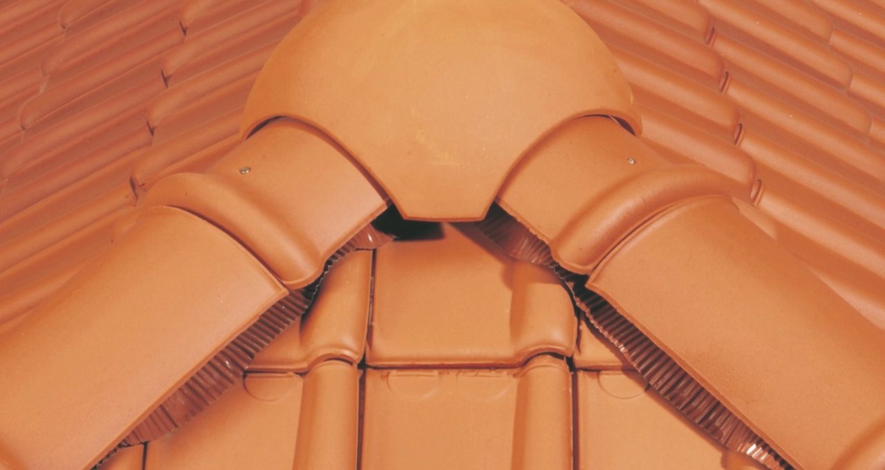 Installing a ridge tile on the roof in a correct way
