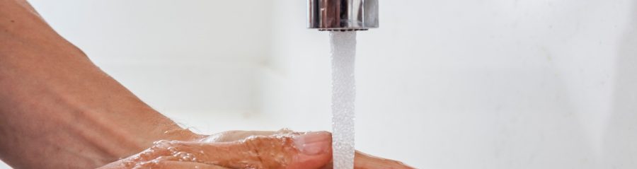 Washing hands under running water
