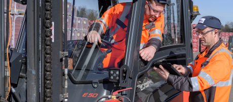 Two male operators working on palletising system, Fast Forward Manufacturing Excellence