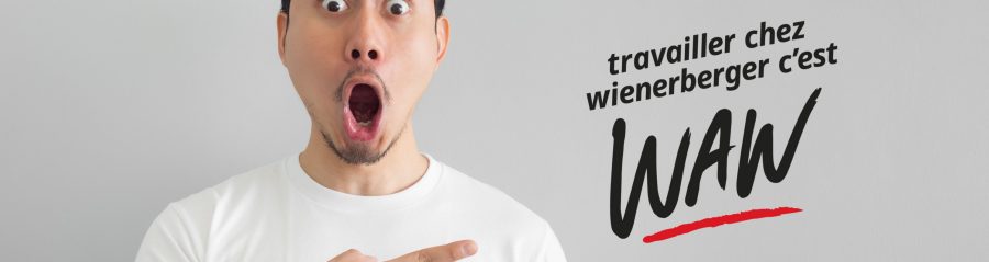 Shocked face of Asian man in white shirt on grey background.