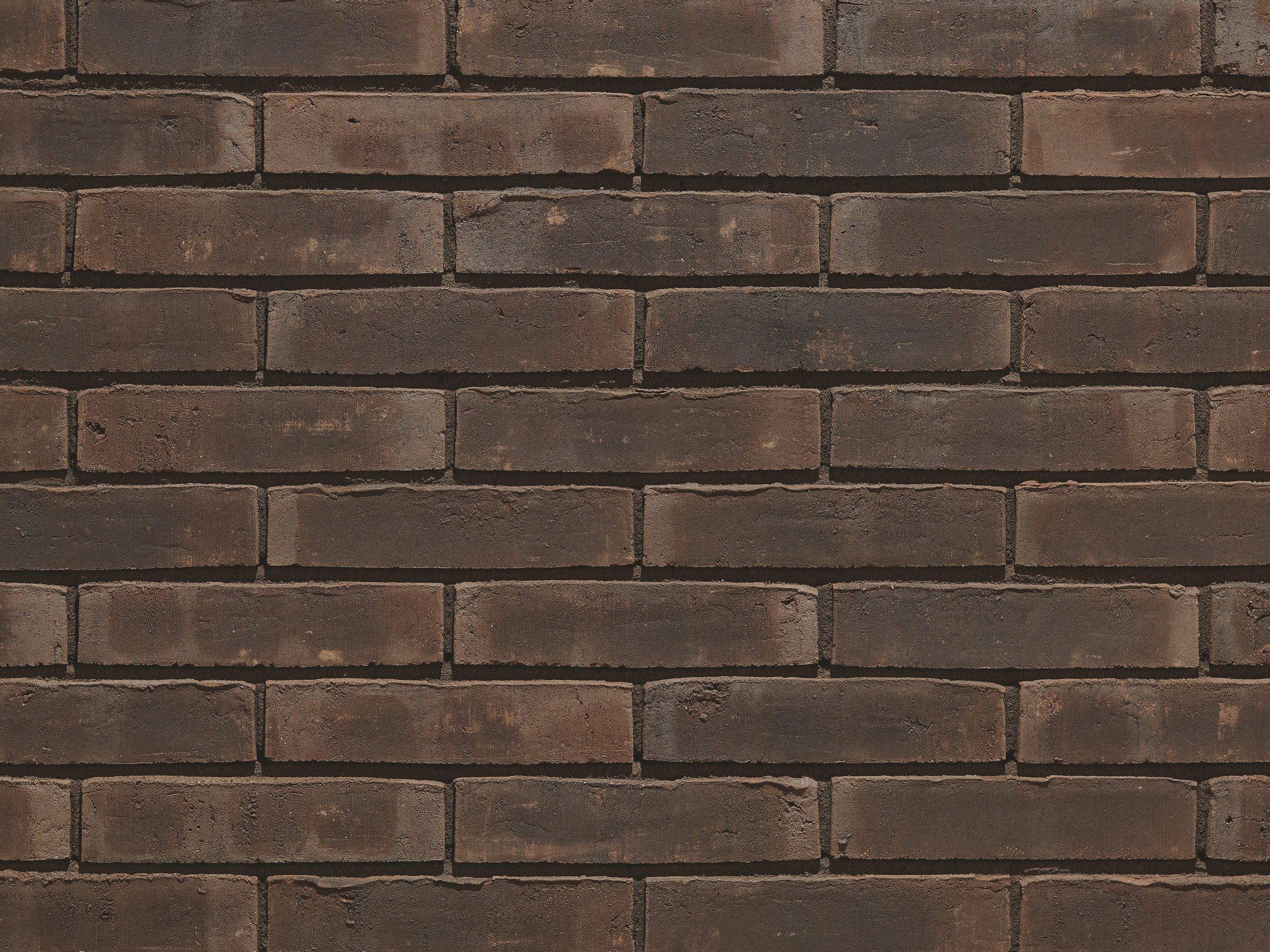 Aquaral Mink Bruin facing bricks in a running bond with thinbed mortar