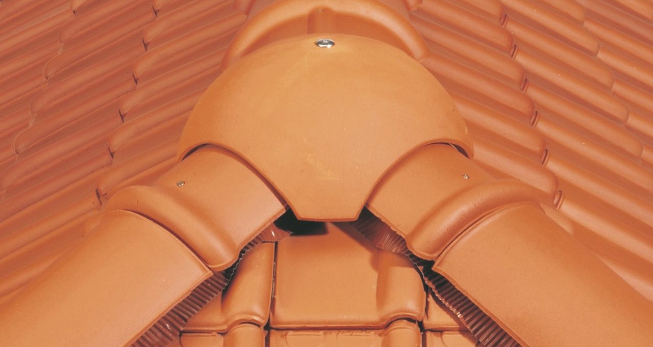 Installing a ridge tile on the roof in a correct way