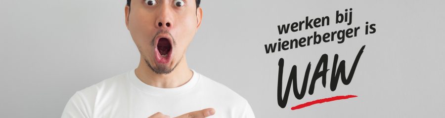 Shocked face of Asian man in white shirt on grey background.