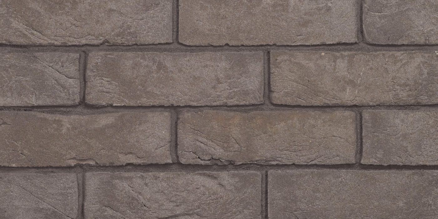 Packshot of a panel with Agora Titaangrijs facing bricks